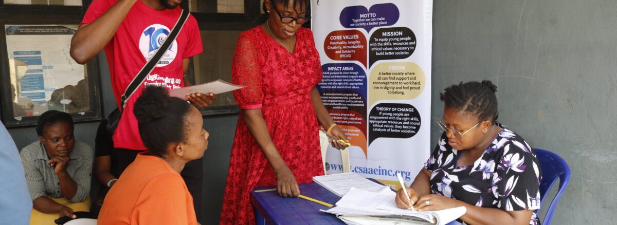 Health insurance agent supporting a Nigerian family during hospital visit